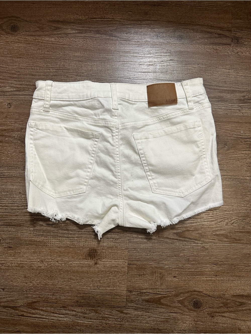 White distressed denim shorts